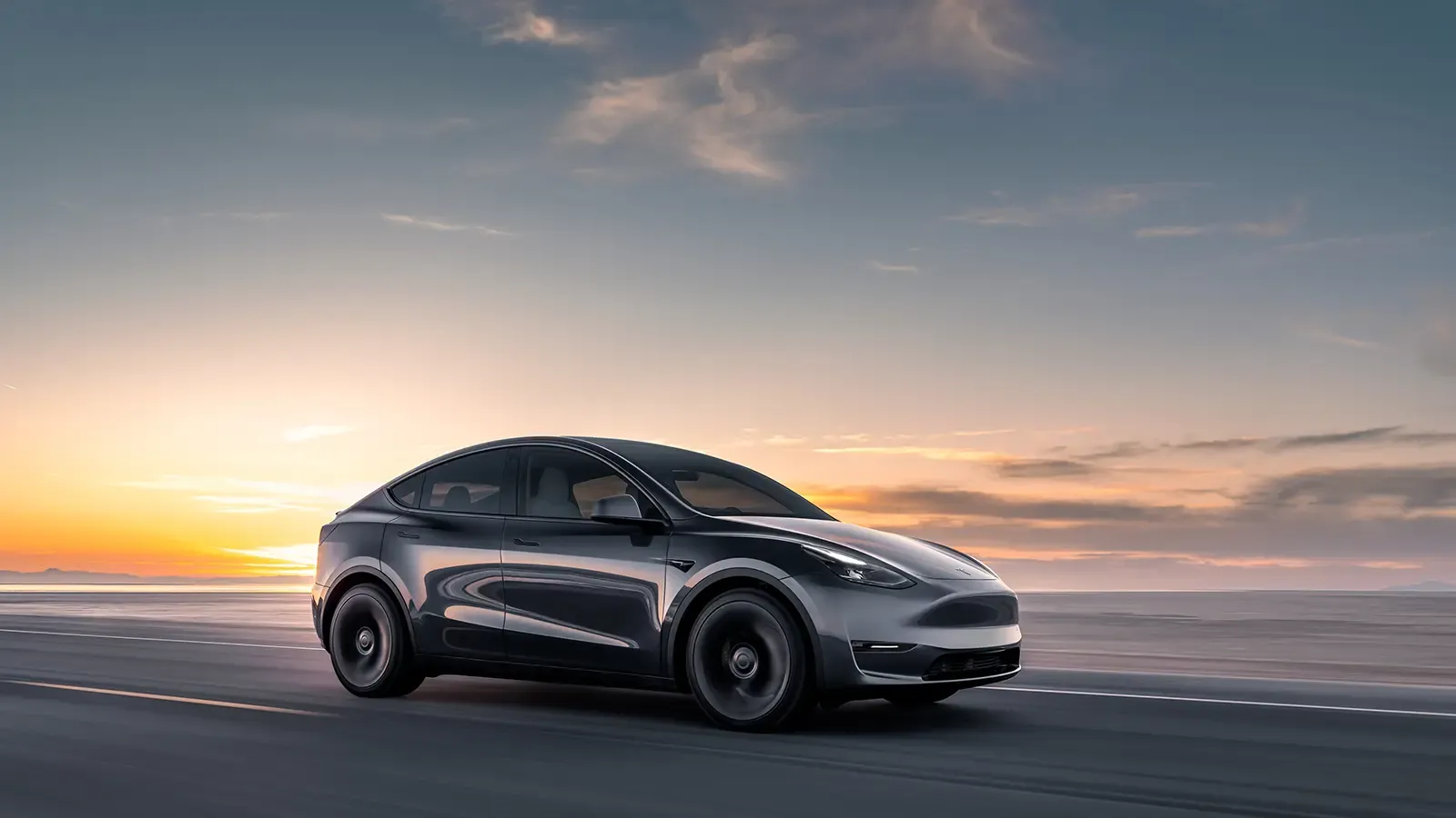 Black Tesla Model Y driving on the road
